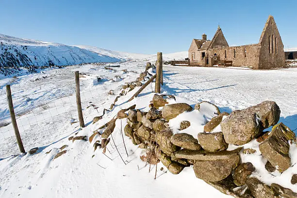 The old chapel of St Jude, Harwood-in-Teesdale, County Durham. This chapel of ease is located in a very remote spot in Upper Teesdale at 1,500 feet above sea level. It was built about 1733 but was never consecrated. The chapel and adjoining schoolhouse closed just after the war and with the removal of the slate roof, the North Pennine elements have gradually reduced the buildings to the shell they are today. The only congregation nowadays are the local sheep who gather inside from the winds that rip down from neighbouring Cross Fell. sRGB embedded profile.