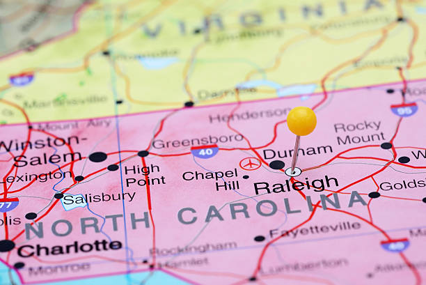 Raleigh pinned on a map of USA Photo of pinned Raleigh on a map of USA. May be used as illustration for travelling theme. state of north carolina map stock pictures, royalty-free photos & images