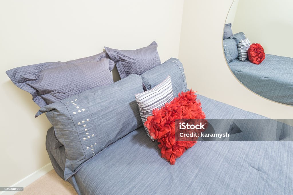 Bedroom Modern bedroom interior in a luxury house with bed and pillows 2015 Stock Photo