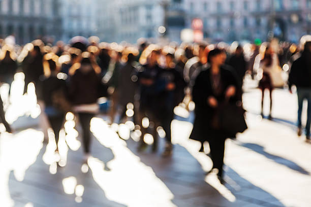 istock people crowd on a city square out of focus 535350085