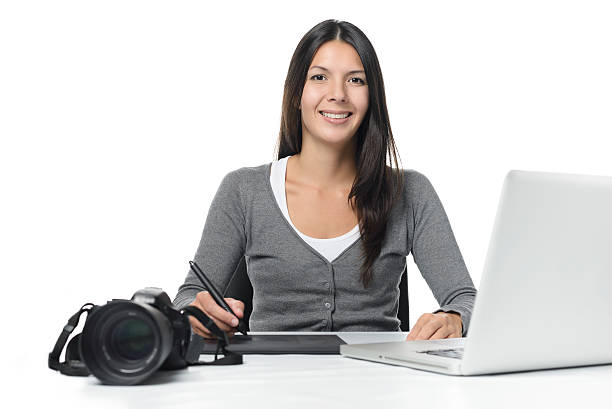istock Female photographer smiling as she does her edits 535352205