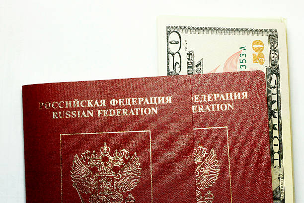 istock Russian Passport And Dollars USA Isolated On White Background 535352539