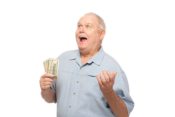 istock Happy senior man with dollar bills 535352941