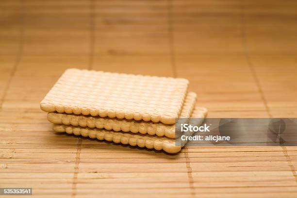 Biscuits Isolated On The Bamboo Mat Stock Photo - Download Image Now - 2015, Backgrounds, Brown