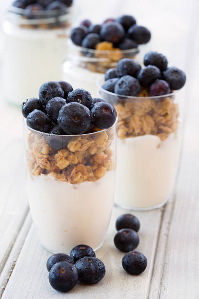 Yogurt and cereal breakfast stock photo