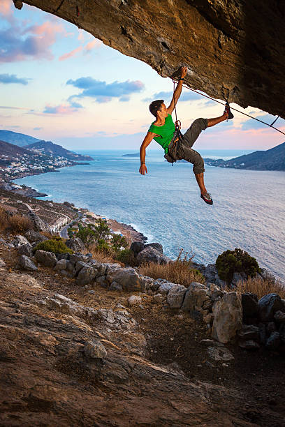istock Male rock climber at sunset 535371691