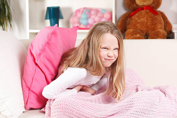 Child having stomach ache stock photo