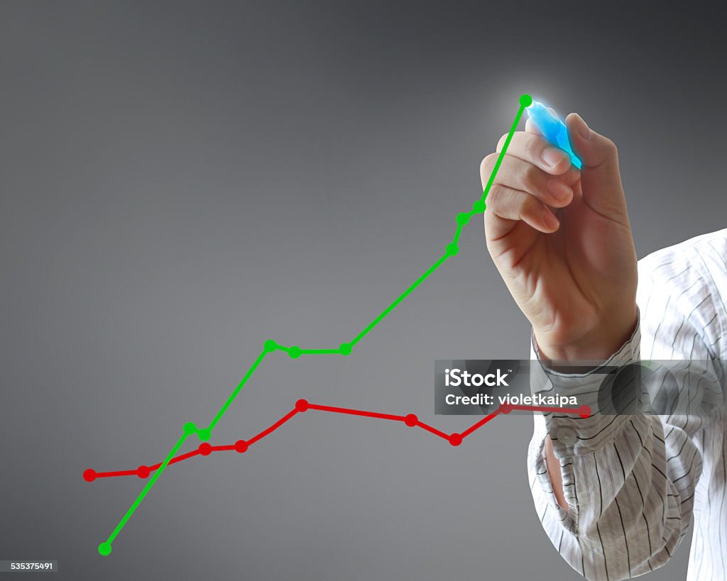 Person Drawing Graph Man Drawing A Graph Stock Photo - Download Image Now - 2015, Business ...