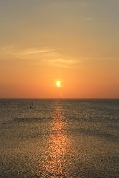 istock verical costa rica sunset with sailboard 535376491