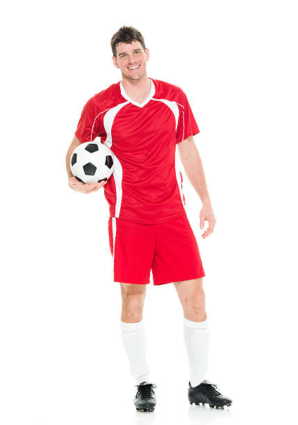 istock Cheerful soccer player holding ball 535398558