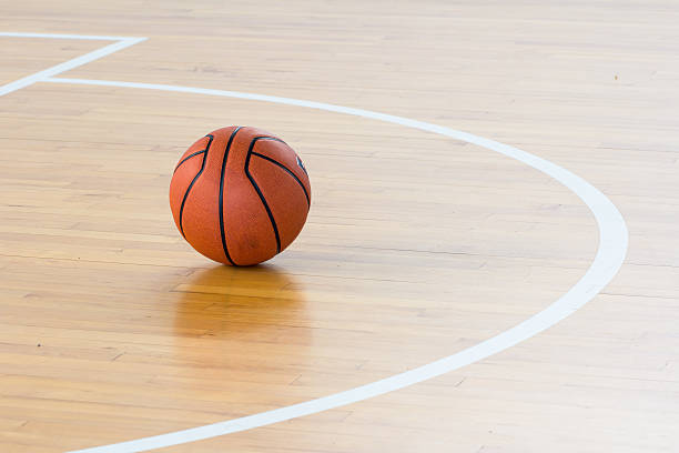 istock Basketball ball over floor in the gym 535399122