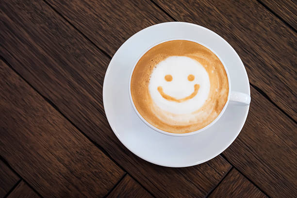 istock White cup of latte art happy smile face. 535399212