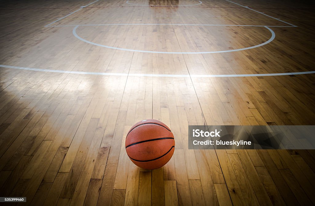 Basketball ball over floor in the gym Backgrounds Stock Photo