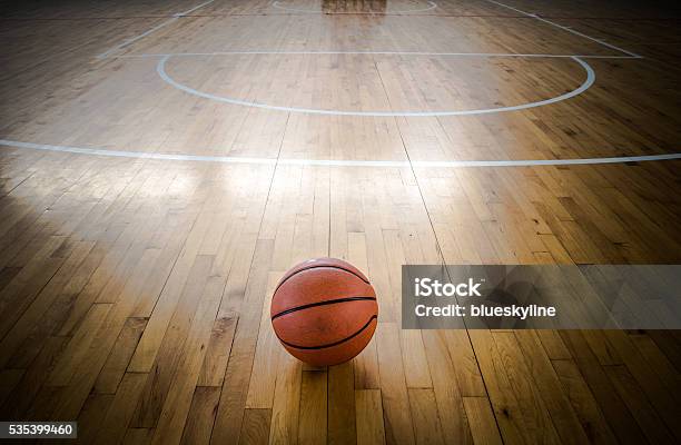 Basketball Ball Over Floor In The Gym Stock Photo - Download Image Now - Backgrounds, Close-up, Equipment