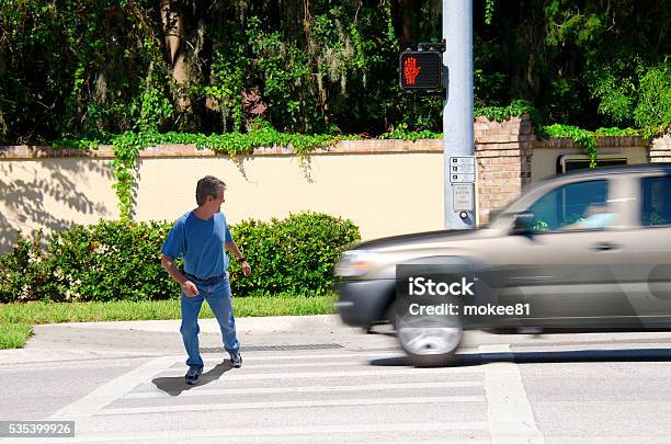 Jaywalking Man About To Be Run Over By Truck Stock Photo - Download Image Now - Pedestrian, Misfortune, Car