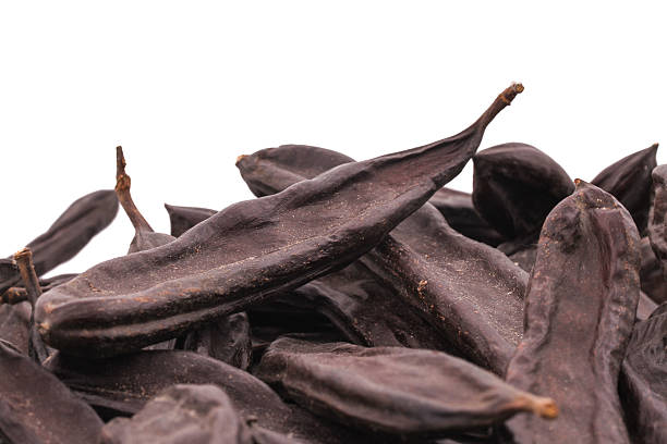 istock The Ripe Carob on the white background 535400369