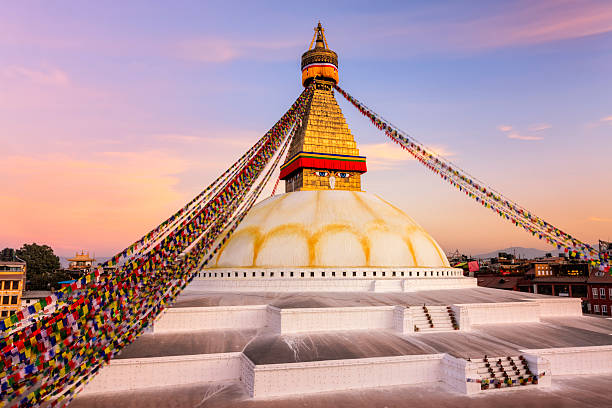 Sunset over Boudhanath World's Largest Stupa, Nepal Sunset over Boudhanath (also called Bouddhanath, Bodhnath or Baudhanath or the Khasa Caitya) -this is one of the holiest Buddhist sites in Kathmandu, Nepal. It is known as Khasti by Newars as Bauddha or Bodh-nath by modern speakers of Nepali. Located about 11 km   from the center and northeastern outskirts of Kathmandu, the stupa's massive mandala makes it one of the largest spherical stupas in Nepal. The Buddhist stupa of Boudhanath dominates the skyline. The ancient Stupa is one of the largest in the world. Thttp://bem.2be.pl/IS/nepal_380.jpg gompa stock pictures, royalty-free photos & images