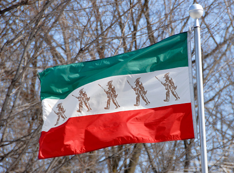 flag of Iran. National Iranian flag on fabric surface. Iranian national flag on textured background. Fabric Texture. Islamic Republic of Iran. Asian country. State symbol of Iran