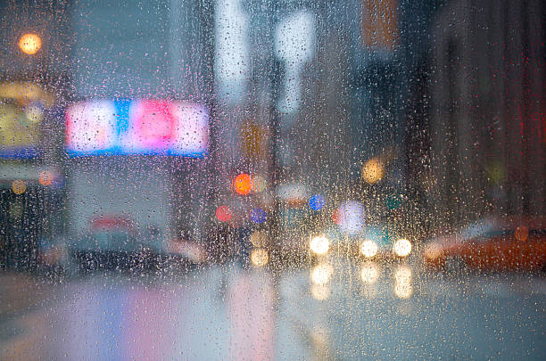 istock Rain drops on the window with traffic light. Toronto 535401022