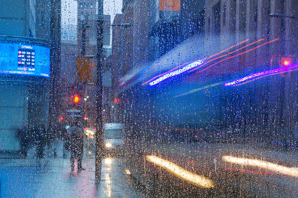 istock Rain drops on the window with traffic light. Toronto 535401118