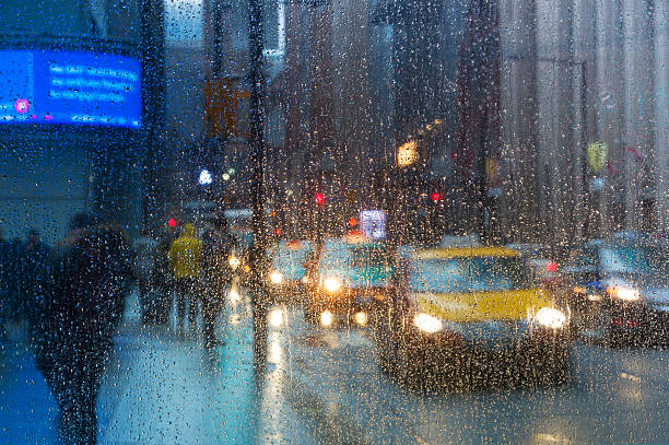 istock Rain drops on the window with traffic light. Toronto 535401132