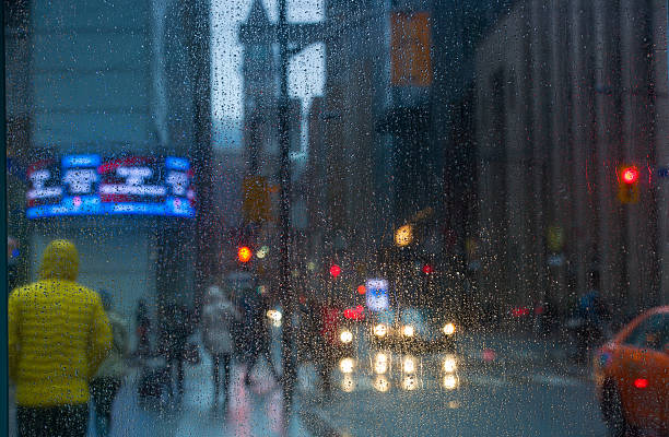 istock Rain drops on the window with traffic light. Toronto 535401150