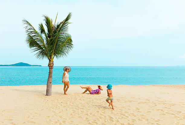 istock Mother with baby at tropical beach 535401662