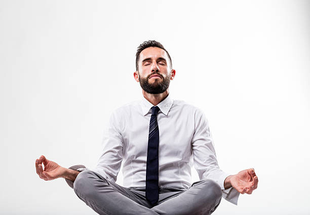 istock relaxed business man in meditation pose 535401676