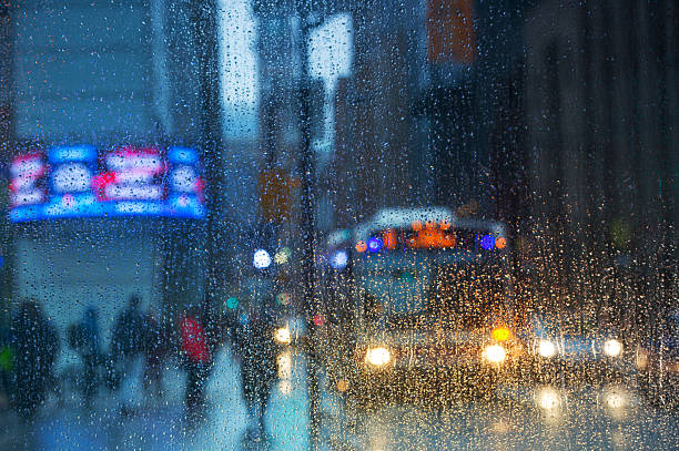 istock Rain drops on the window with traffic light. Toronto 535401734