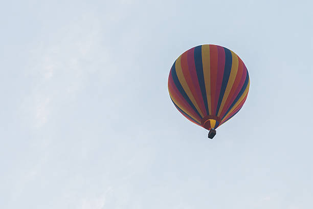 istock colorful hot air balloon in blue cloudy sky 535402934