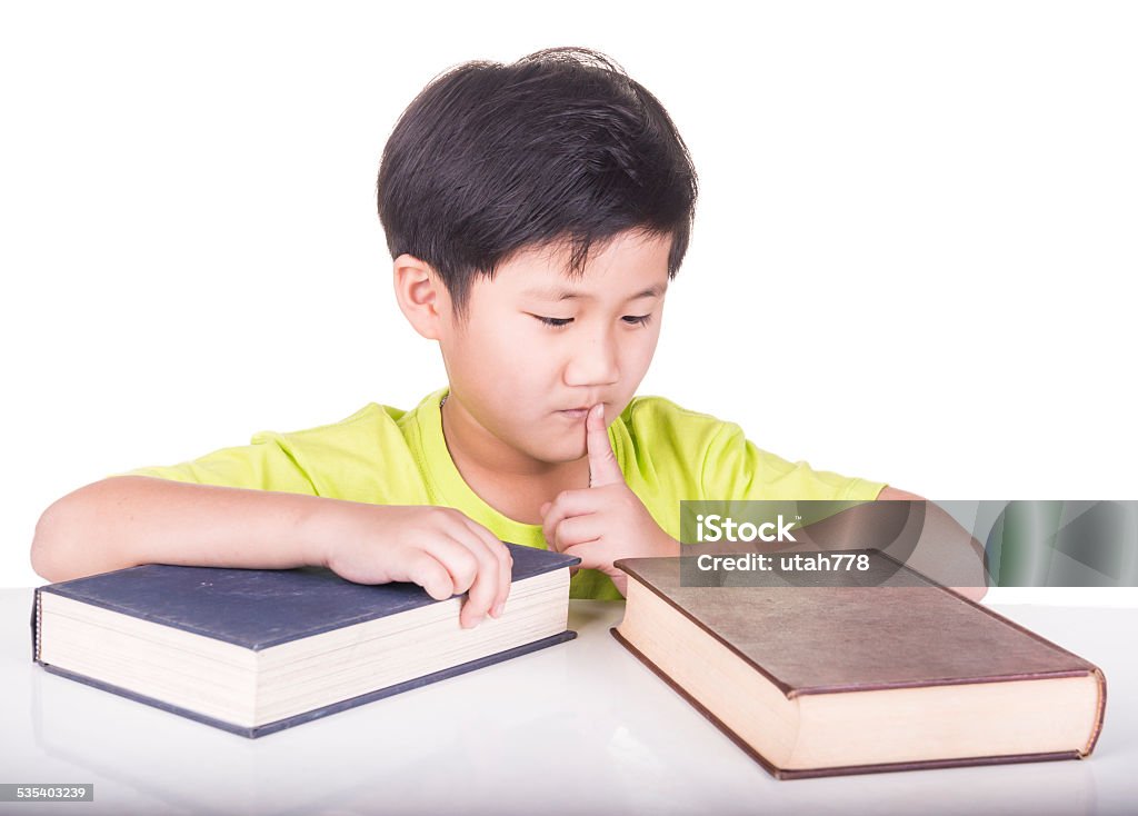 boy Little boy are choosing a book to read 2015 Stock Photo