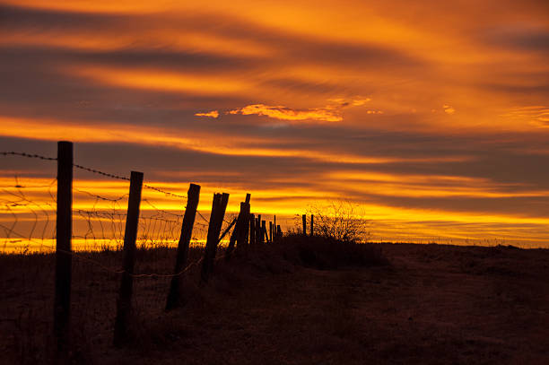 istock Orange Prairie Sunrise And Fence 535404083