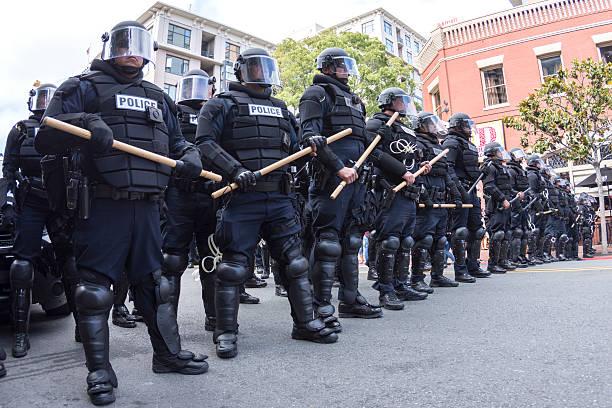 San Diego, California, USA - May 27, 2016: Riot police in full tactical gear stand ready to confront protesters at a Trump rally at the San Diego Convention Center