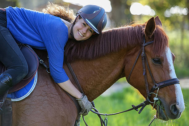istock girl hugging horse 535404382