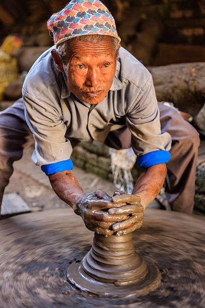 istock Nepali potter working on the pottery square in Bhaktapur 535404383