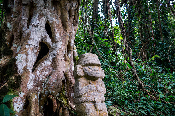 Statue in the rainforest in San Agustin stock photo