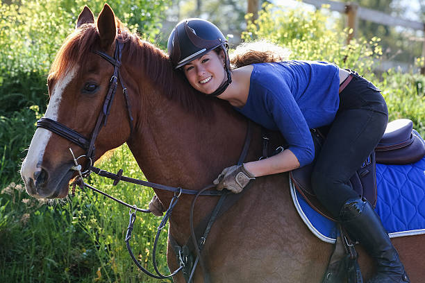 istock girl hugging horse 535404420