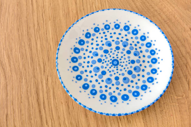 Homemade Dotted Porcelain Plate On Oak Table.