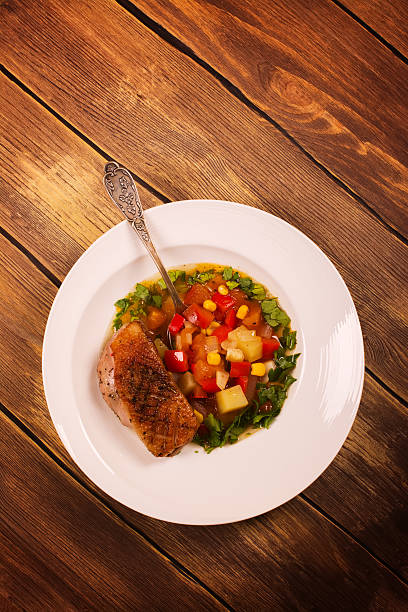 istock Spanish hot vegetable stew with duck breast 535405820