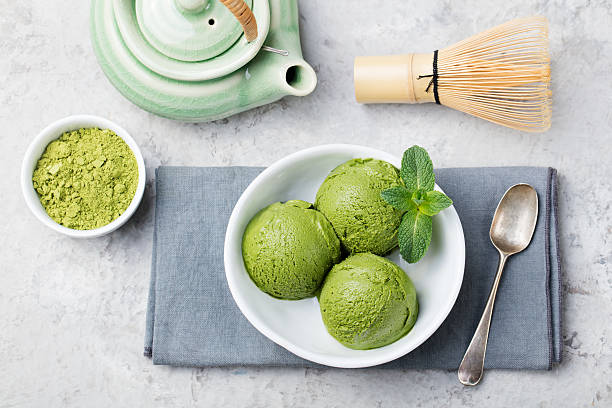 istock Green tea matcha ice cream scoop in white bowl 535405916