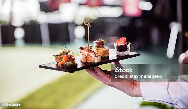 Waiter With Spanish Appetizer Stock Photo - Download Image Now - Canape, Waiter, Serving Food and Drinks