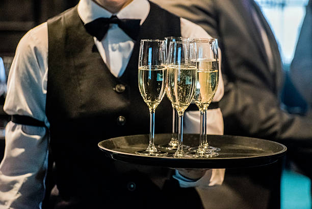 waiter with champagne stock photo