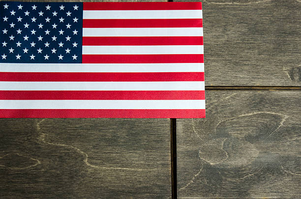 istock American flag on a wooden background 535407648