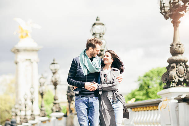 istock Couple in love walking in pont Alexander bridge. 535408756