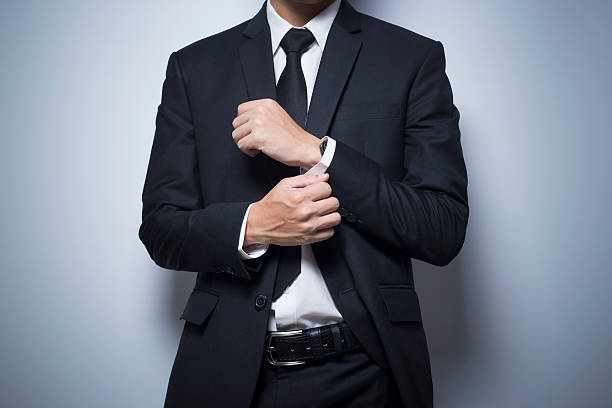 istock Businessman adjusting his cufflinks 535411590