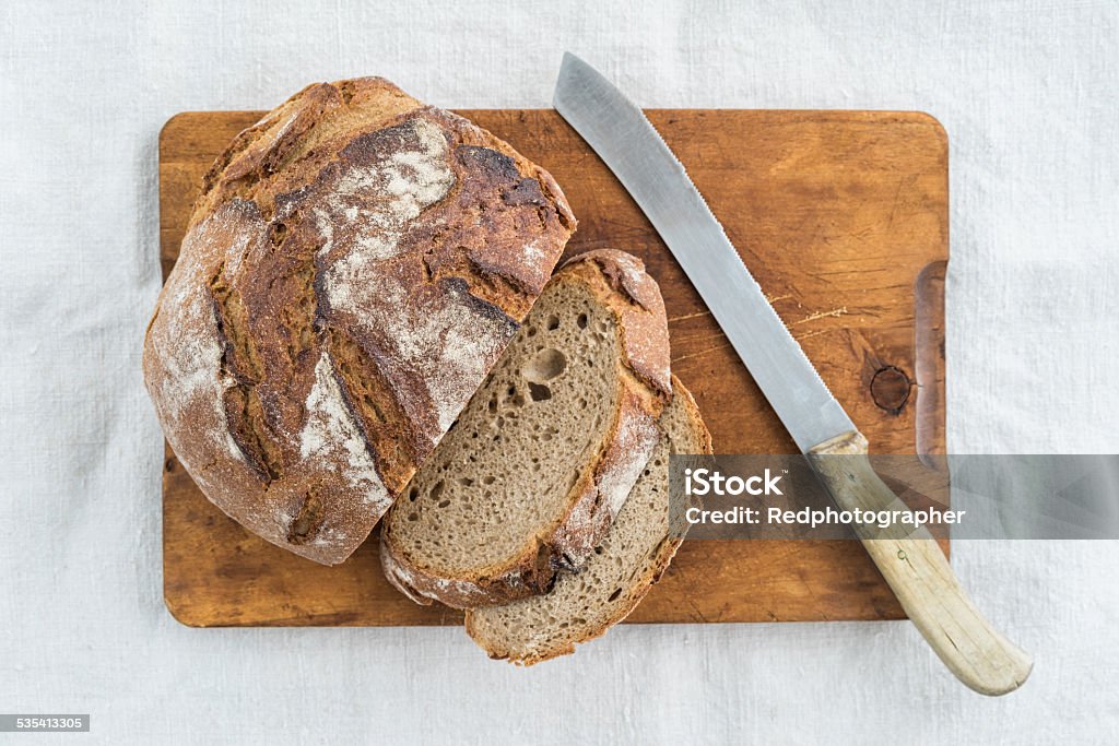 Rustic bread Rustic sourdough bread and knife 2015 Stock Photo