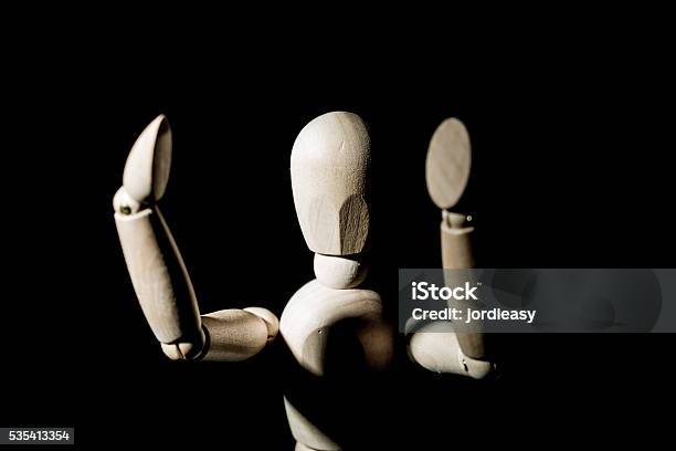 Wooden Toy Dummy On A Black Background Stock Photo - Download Image Now - Back Lit, Black Background, Bright