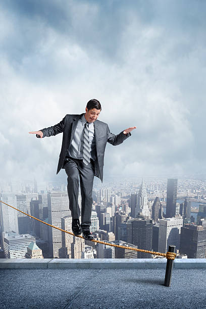 istock Businessman Balancing On A Tightrope 535415317
