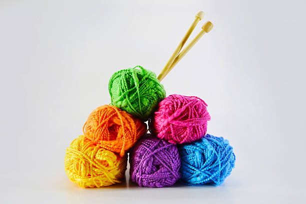 Colorful balls of wool with sticks stock photo