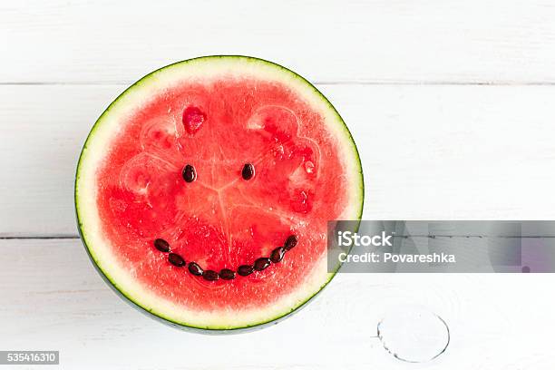 Watermelon With Smile On White Wooden Background Stock Photo - Download Image Now - Watermelon, Anthropomorphic Smiley Face, Fruit